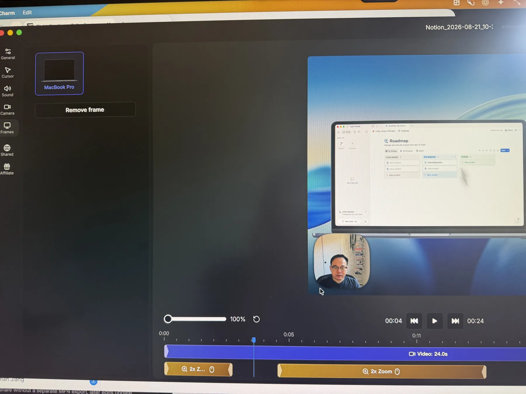 Phone photo of the Screen Charm Frames panel showing a MacBook Pro device frame around a macOS desktop recording and a Remove frame button